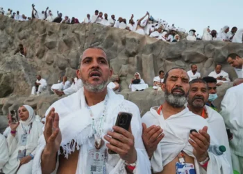 Muslim pilgrims gather near the Kaaba during the annual Hajj pilgrimage - AP Photo/Amr Nabil, File