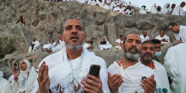 Muslim pilgrims gather near the Kaaba during the annual Hajj pilgrimage - AP Photo/Amr Nabil, File