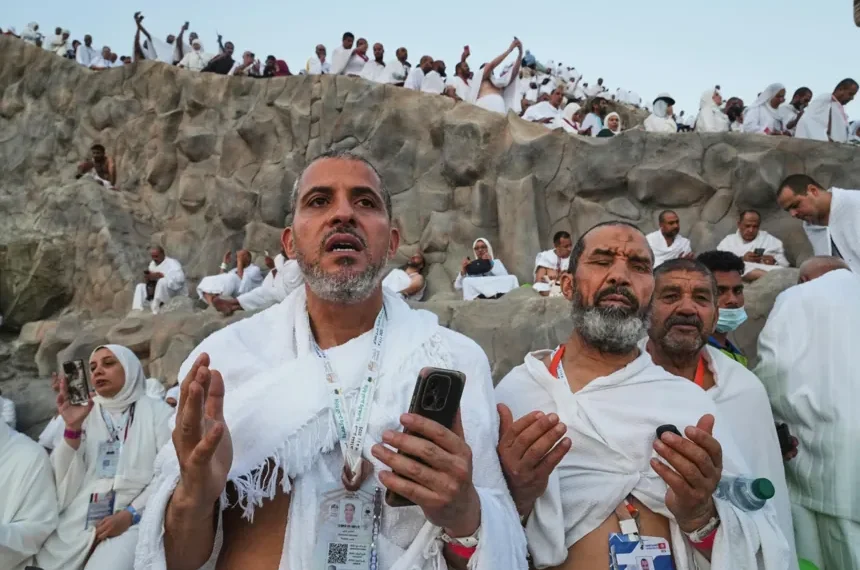 Muslim pilgrims gather near the Kaaba during the annual Hajj pilgrimage - AP Photo/Amr Nabil, File