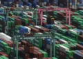 Shipping containers stacked at a Japanese port during export growth - Michi Ono/Kyodo News via AP