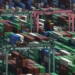 Shipping containers stacked at a Japanese port during export growth - Michi Ono/Kyodo News via AP