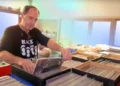 Jon Ordon surrounded by thousands of vinyl records in storage - Credit: Headphonesty