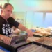 Jon Ordon surrounded by thousands of vinyl records in storage - Credit: Headphonesty