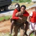 Emergency responders outside burned girls school dormitory in Kenya - AP Photo/Andrew Kasuku