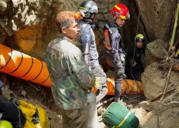 Rescue teams gather near a flooded cave site in northern Laos - Metta Tham Rescue Kalasin via AP