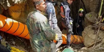Rescue teams gather near a flooded cave site in northern Laos - Metta Tham Rescue Kalasin via AP