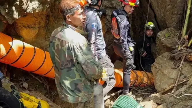 Rescue teams gather near a flooded cave site in northern Laos - Metta Tham Rescue Kalasin via AP