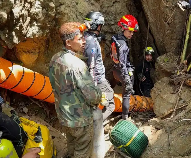 Rescue teams gather near a flooded cave site in northern Laos - Metta Tham Rescue Kalasin via AP
