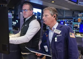 Traders react as Micron stock rally lifts Wall Street indexes - AP Photo/Richard Drew