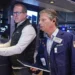 Traders react as Micron stock rally lifts Wall Street indexes - AP Photo/Richard Drew