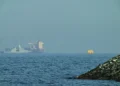Naval vessels escort tankers through Strait of Hormuz amid tensions