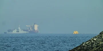 Naval vessels escort tankers through Strait of Hormuz amid tensions