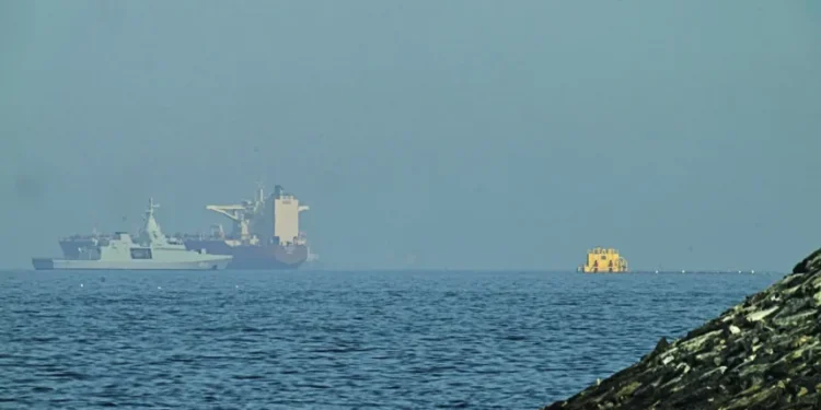 Naval vessels escort tankers through Strait of Hormuz amid tensions