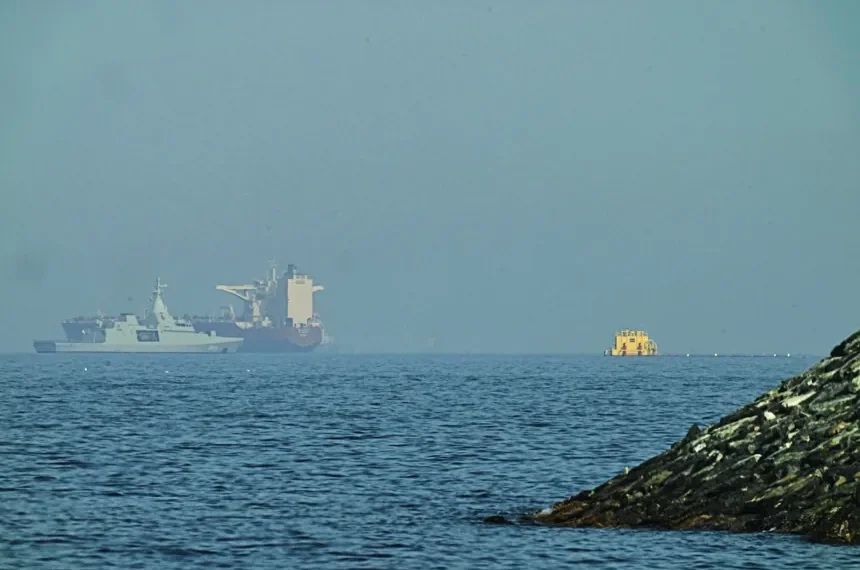 Naval vessels escort tankers through Strait of Hormuz amid tensions