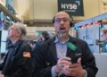 Traders monitor rising oil prices and record U.S. stock indexes - AP Photo/Richard Drew