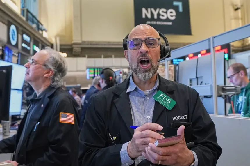 Traders monitor rising oil prices and record U.S. stock indexes - AP Photo/Richard Drew
