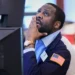 Traders monitor U.S. stock markets as oil prices fluctuate sharply - AP Photo/Richard Drew