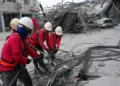 Rescue workers search through rubble after hotel collapse in Pampanga - AP Photo/Aaron Favila