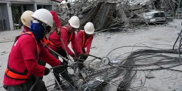 Rescue workers search through rubble after hotel collapse in Pampanga - AP Photo/Aaron Favila