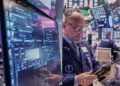 Rising U.S. mortgage rates amid strong Wall Street market performance - AP Photo/Richard Drew