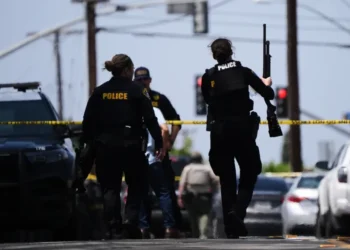 Police respond outside the Islamic Center of San Diego after a deadly shooting- AP Photo/Gregory Bull