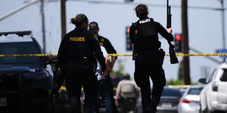 Police respond outside the Islamic Center of San Diego after a deadly shooting- AP Photo/Gregory Bull