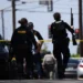 Police respond outside the Islamic Center of San Diego after a deadly shooting- AP Photo/Gregory Bull