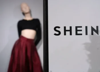 Shein and Everlane logos representing proposed fashion industry acquisition - AP Photo/Aurelien Morissard, File