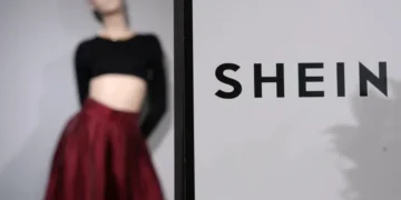 Shein and Everlane logos representing proposed fashion industry acquisition - AP Photo/Aurelien Morissard, File