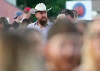 Tall adults gathering together during a social meetup event - AP Photo/David J. Phillip