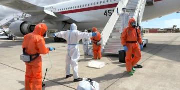 Passengers evacuated from MV Hondius during hantavirus containment operation - AP Photo