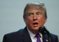 Donald Trump during announcement tied to IRS settlement dispute - AP Photo/Julia Demaree Nikhinson