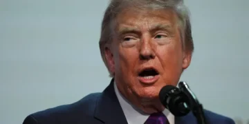 Donald Trump during announcement tied to IRS settlement dispute - AP Photo/Julia Demaree Nikhinson