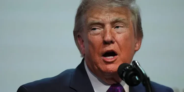 Donald Trump during announcement tied to IRS settlement dispute - AP Photo/Julia Demaree Nikhinson