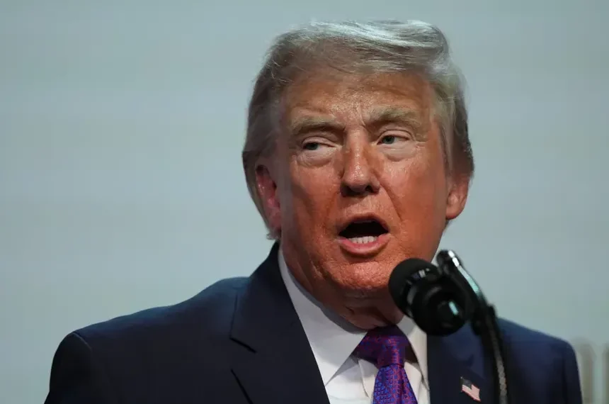 Donald Trump during announcement tied to IRS settlement dispute - AP Photo/Julia Demaree Nikhinson