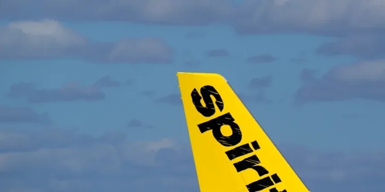 Donald Trump speaking as Spirit Airlines aircraft sits on runway - AP Photo/wilfredo Lee, File