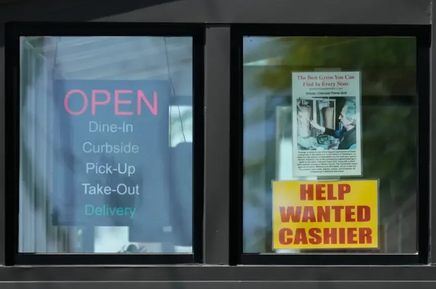 Hiring sign displayed outside US business amid labor market uncertainty - AP Photo/Nam Y. Huh