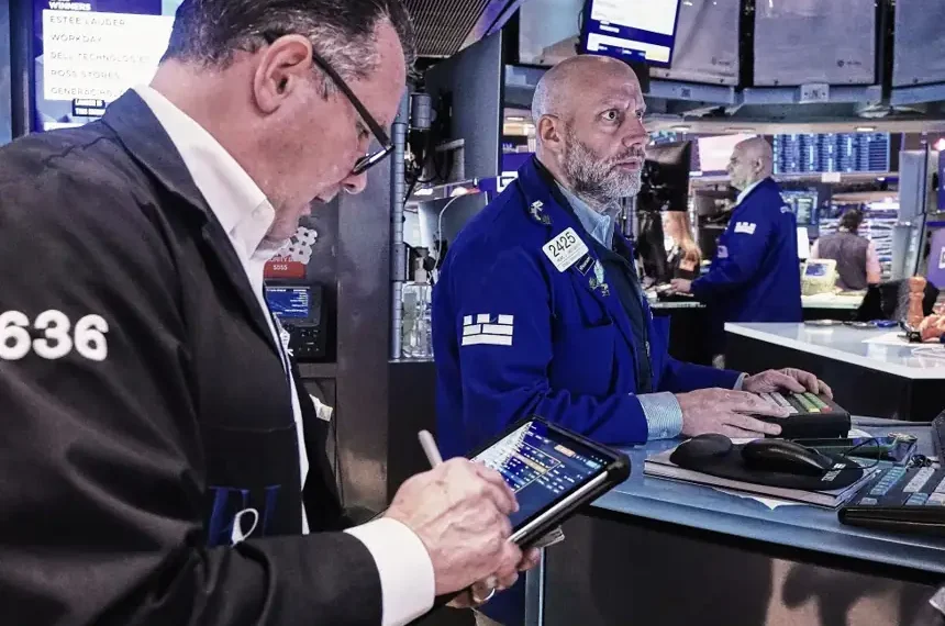 Traders monitor U.S. stock market gains as oil prices decline - AP Photo/Richard Drew