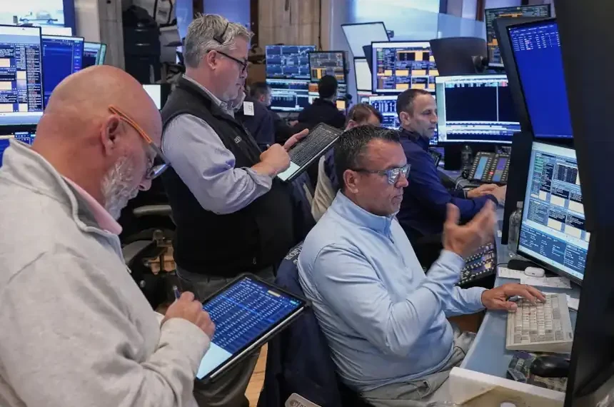 Traders on NYSE as oil prices fluctuate amid geopolitical tensions - AP Photo/Richard Drew