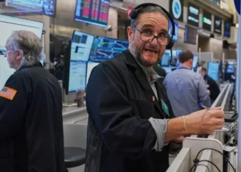 Traders monitor rising U.S. stocks on Wall Street trading floor - AP Photo/Richard Drew