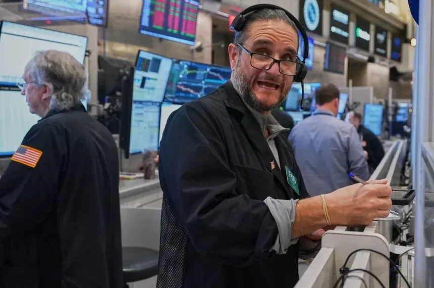 Traders monitor rising U.S. stocks on Wall Street trading floor - AP Photo/Richard Drew