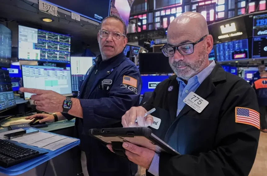 Traders on Wall Street amid rising inflation and consumer anxiety - AP Photo/Richard Drew