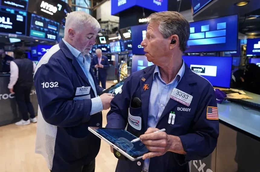 Traders react as AI stocks lift Wall Street records - AP Photo/Richard Drew