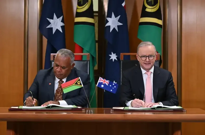 Australian and Vanuatu leaders sign bilateral security agreement in Canberra. - Lukas Coch/AAP Image via AP