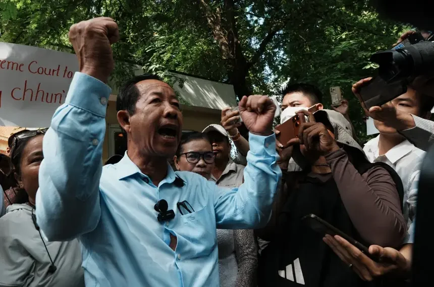 Rong Chhun greets supporters outside Cambodia Supreme Court - AP Photo/Heng Sinith