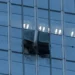 Damaged facade of Beijing skyscraper after light aircraft collision - AP Photo/Han Guan Ng