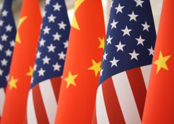 Chinese and American flags amid escalating trade and defense tensions - AP Photo/Mark Schiefelbein, File