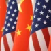 Chinese and American flags amid escalating trade and defense tensions - AP Photo/Mark Schiefelbein, File