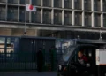 China and Japan flags symbolize growing trade and diplomatic tensions. - AP Photo/Ng Han Guan