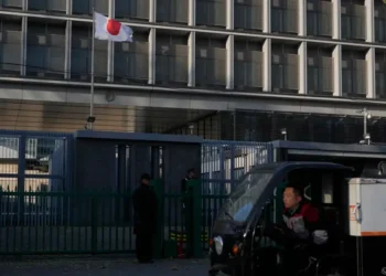 China and Japan flags symbolize growing trade and diplomatic tensions. - AP Photo/Ng Han Guan